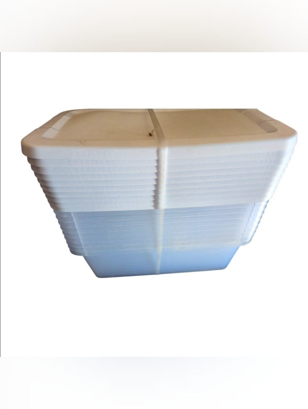 Stack of White Plastic Storage Bins With Lids